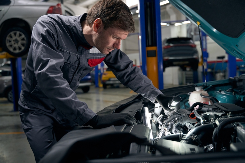 man-conducts-full-technical-check-of-auto-2025-03-06-01-01-59-utc