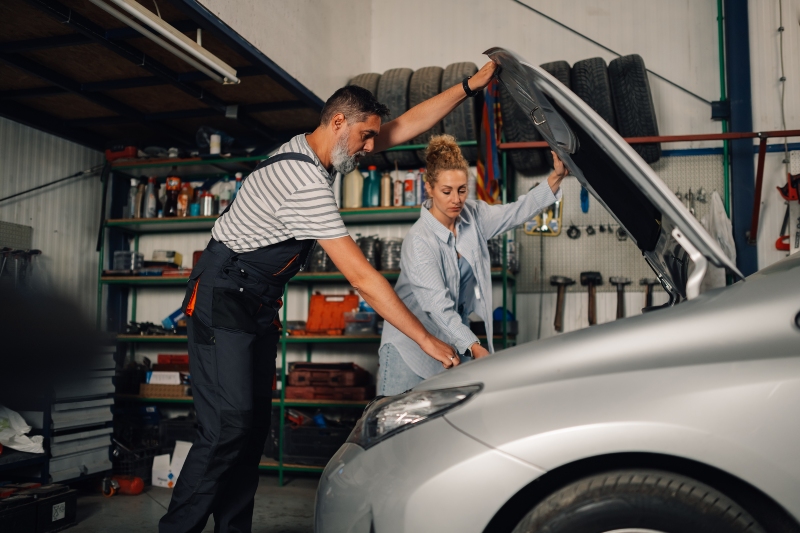 professional-repairman-with-female-customer-lookin-2025-04-03-20-42-00-utc
