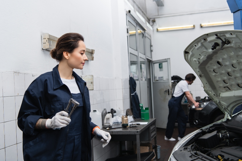 side-view-of-workwoman-in-gloves-holding-tool-near-2024-11-08-16-43-18-utc
